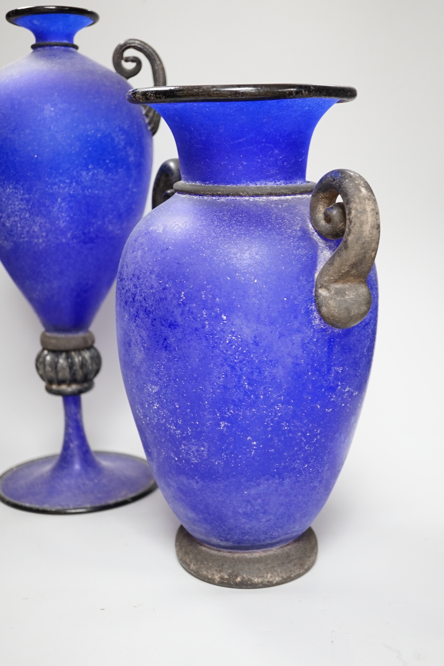 Two glass twin handled Roman style urns including a pedestal example, one signed Gambaro & Poggi, the largest 43cm high
